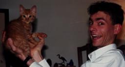 Picture of Jim with Chester the cat.